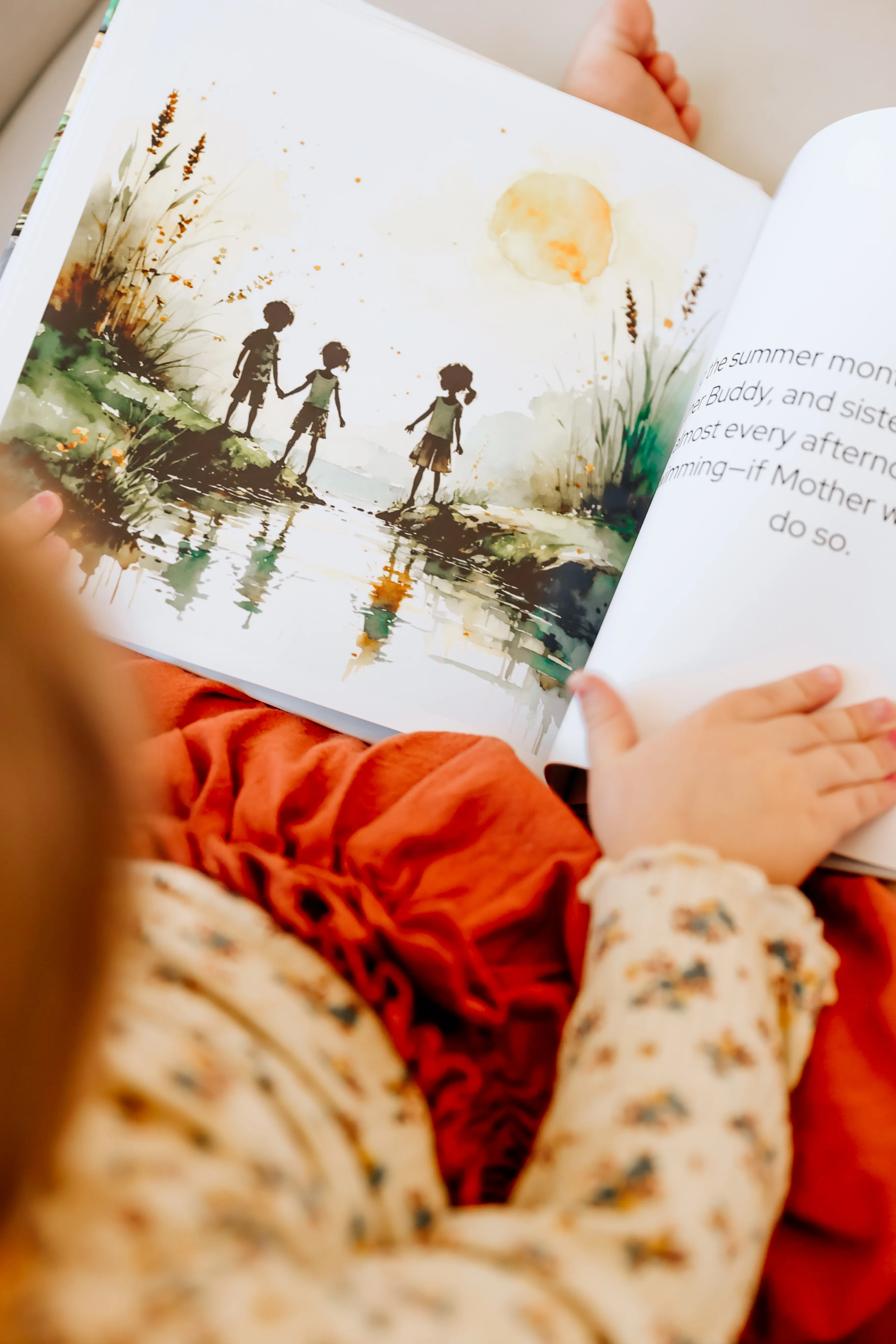 A child reading a personalized Lore storybook with watercolor illustrations